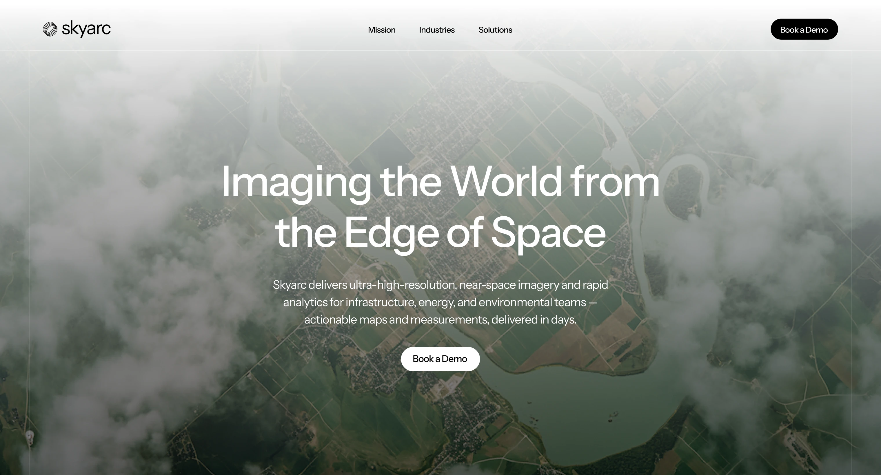 Aerial view of a river and landscape partially covered by clouds with text overlay about high-resolution near-space imagery.